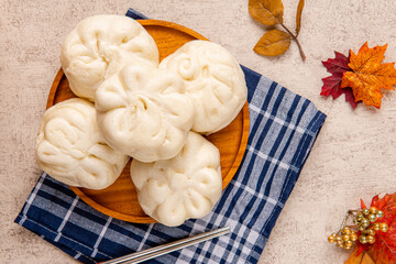 Baozi or Bakpao is a type of yeast-leavened filled bun in various Chinese cuisines. There are many variations in fillings (meat or vegetarian) and preparations, though the buns are most often steamed.