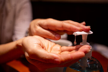 Asian woman hands for press alcohol gel