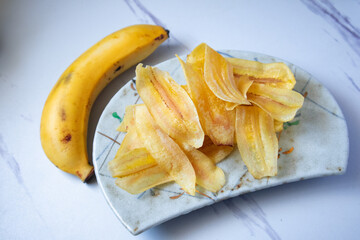 Banana Chips on a gray marble background
