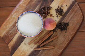 spices and peach on cutting board