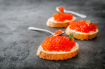 Delicious snack sandwiches with red caviar