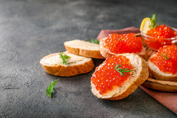 Delicious snack sandwiches with red caviar