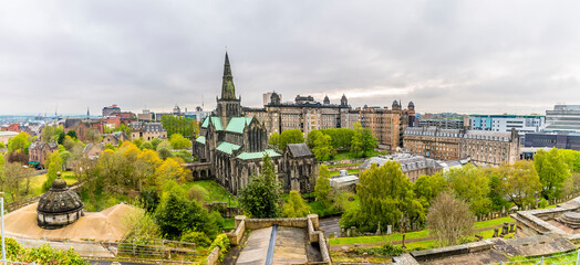 Fototapeta premium A panorama view from the Necropolis towards the Cathedral and hospital districts in Glasgow on a summers evening 