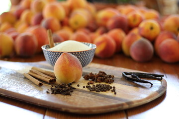 Peaches and spices on table and cutting board