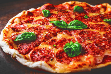 Pepperoni Pizza with Mozzarella cheese, salami, Tomato sauce, pepper, Spices. Italian pizza on wooden table background