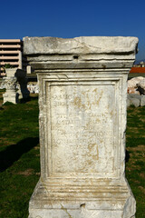 Fototapeta na wymiar Greek craftsmanship engraved on White marble, Greek scripts on White stone in Izmir, Turkey.