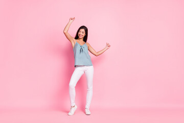 Full body photo of funky happy cheerful young woman dance good mood enjoy isolated on pink color background