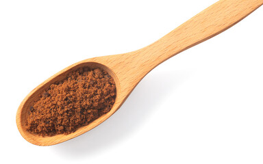 brown sugar in the wooden spoon, isolated on white background, top view