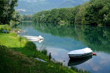 Boats on the Adda River, Lecco Province - obrazy, fototapety, plakaty