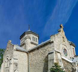 Old stone church of the early 20th century on a background of blue sky