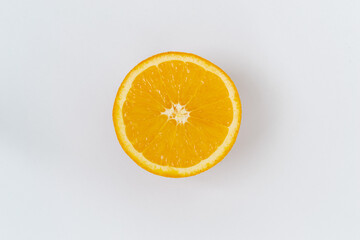 Top view of one orange round fruit on a white background. Rich citrus texture. Copy space