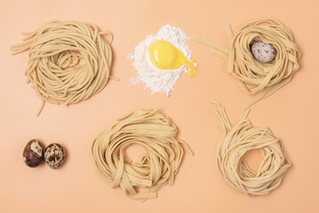 Handmade Raw Noodles Eggs and Flour on Yellow Background Horizontal Top View Italian Pasta