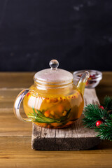Tasty and Hot Tea from Berries of a Sea Buckthorn and Fresh Rosemary Cozy Hot Beverage Wooden Background Vertical