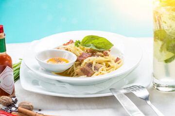 Breakfast with swimming pool background . Close up shot of pasta dishes on the swimming pool