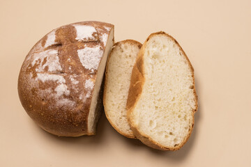 Sliced Handmade Fresh Baked White Bread on Red Linen Cloth on Yellow Background Top View Horizontal