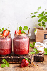 Strawberry chia pudding in glass jars.