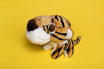 Close-up of a soft toy tiger. The tiger is a symbol of the next year 2022. The coming year of the tiger is 2022. Children's toy.