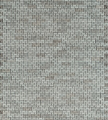 Concrete brick close up. Texture of a stone gray wall. Fence made of concrete blocks.