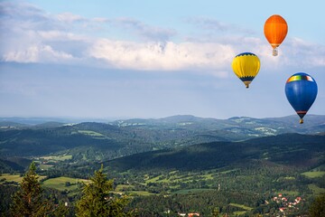 balloons fly beautifully, mountain landscape