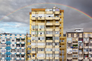 Building exterior and sky with rainbow