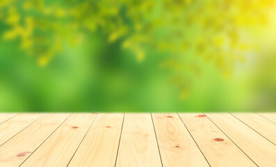 Naklejka na ściany i meble Wood table top on shiny bokeh green background. For product display