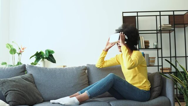 African american woman playing video games with 3d viso