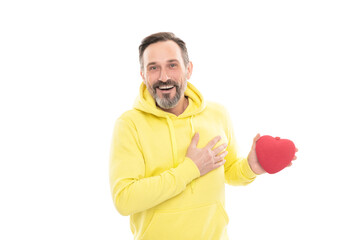 smiling senior guy hold present isolated on white. man in yellow hoody.