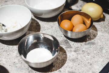Ingredient for baking homemade sweets: eggs, flour and sugar in a bowl