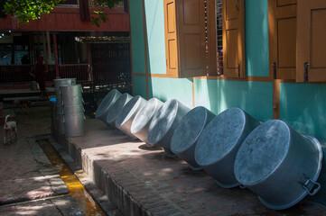 Drying pots outside for the daily the Mahagandayon Monastery lunch for monks