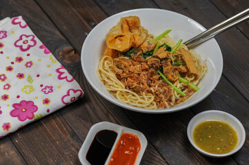 Indonesian food, mie ayam, noodles with chicken and served with meatballs
