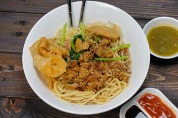 Indonesian food, mie ayam, noodles with chicken and served with meatballs