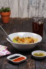 Indonesian food, mie ayam, noodles with chicken and served with meatballs