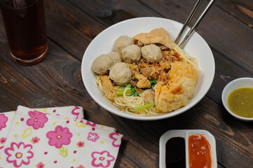 Indonesian food, mie ayam, noodles with chicken and served with meatballs