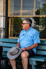 man sitting on bench