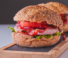 Bacon,lettuce and tomato in a roll.