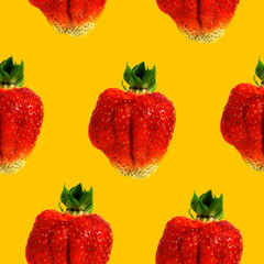 Strawberries on a yellow background seamless pattern
