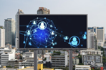 Glowing Social media icons on road billboard over panoramic city view of Bangkok, Southeast Asia. The concept of networking and establishing new connections between people and businesses.