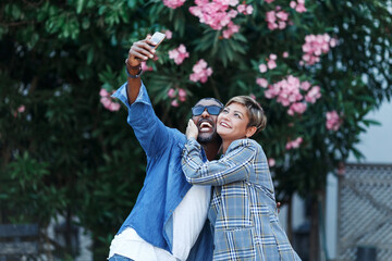 Happy Moments. Cheerful Black Couple Taking Selfie On Smartphone While Having Romantic Date travel, middle age African American Spouses in trip. Mixed race couple .