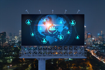 World planet Earth map hologram and social media icons on billboard over night panoramic city view of Bangkok, Southeast Asia. Networking and establishing new connections between people. Globe