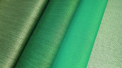 fabric organza texture in green ,turquoise color tone. close up woolen fabric for interior drapery...