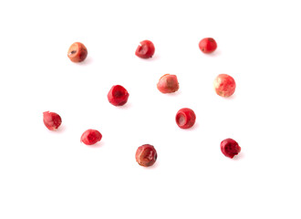 pink peppercorns seeds isolated on white background