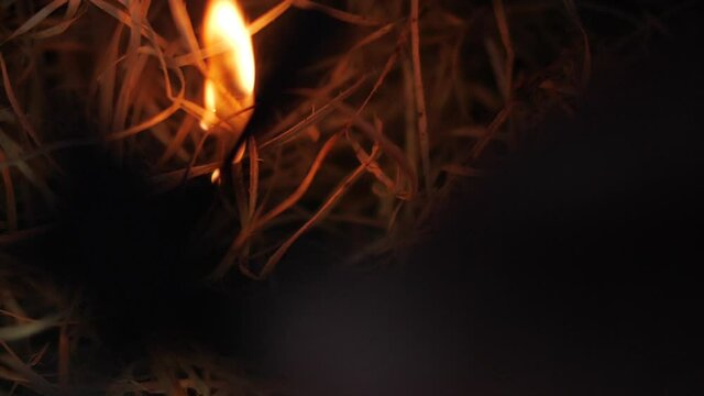 Making fire with a magnesium fire starter. Survival tool setting up a campfire. Slow-motion 180fps. Sparks. High quality FullHD footage