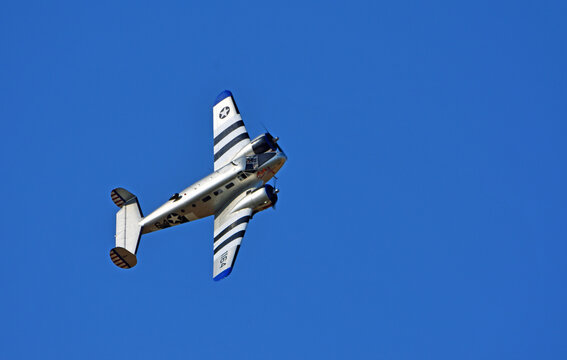Beech 3TM (Model 18) Aircraft with blue sky background.