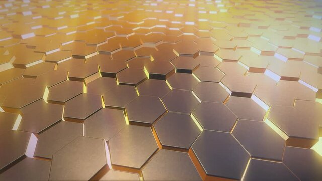 Video animation of an abstract background of moving hexagons in yellow - gold - seamless loop