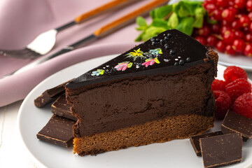 Piece of chocolate cake on table close up