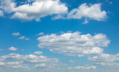Naklejka na ściany i meble Sinn sky with small light white clouds. Clear sunny weather. Bright day