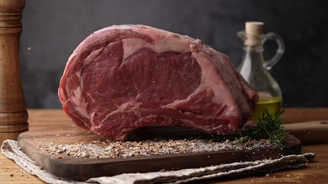 dropping chunk of ribeye beef on spice, 240p