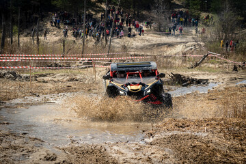 Offroad vehicle makes splashes of dirty water at sunny day © Antonio