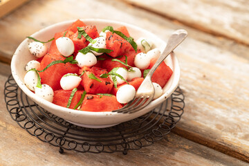 Plate with watermelon and mozzarella cheese - obrazy, fototapety, plakaty