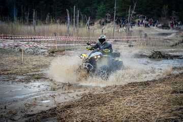 Professional quad biker rides fast on sand. Quad racing, ATV 4x4